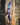 'Sentient' Lanyard by Indigenous Student Hollie Johnson for RMIT University. Lanyard is laying on a log in a semi tussled layout.