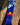 'Sentient' Lanyard by Indigenous Student Hollie Johnson for RMIT University. Lanyard displayed on a log with an up close view of the Aboriginal Flag.
